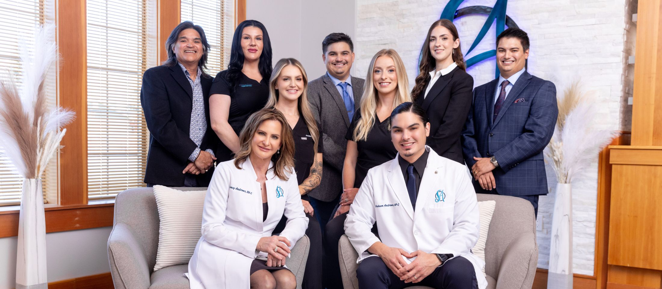 Healthcare team posing in professional setting.