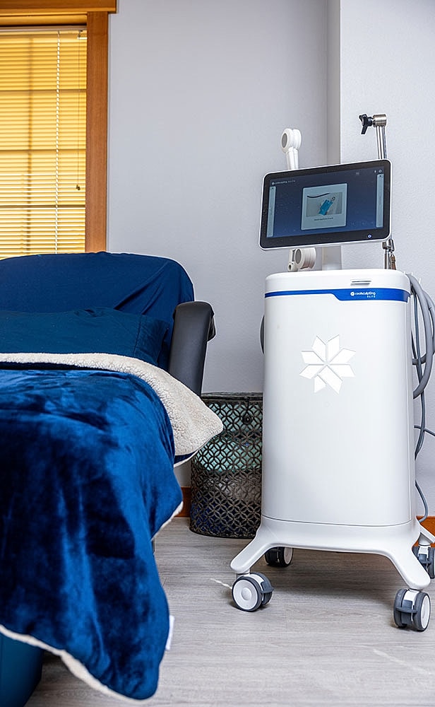 Medical equipment beside a treatment chair.