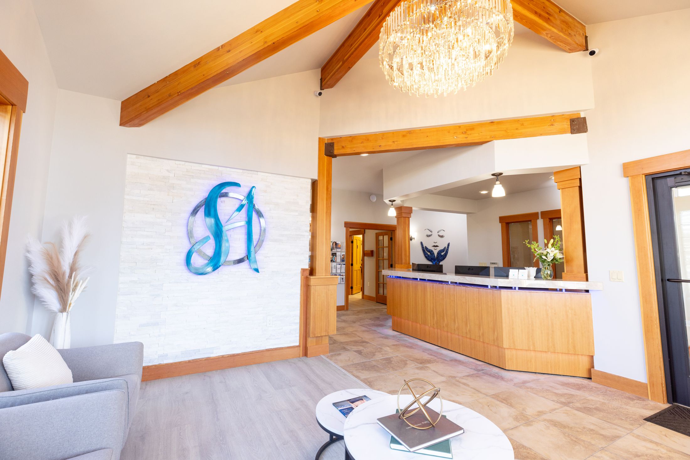 Modern reception area with stylish decor and lighting.